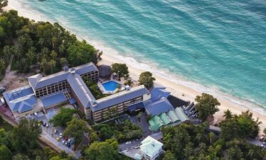 Aerial view of Coral Strand Hotel Seychelles by the turquoise ocean