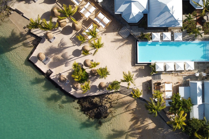 Aerial view of pool and beach at Veranda Grand Baie with palm trees