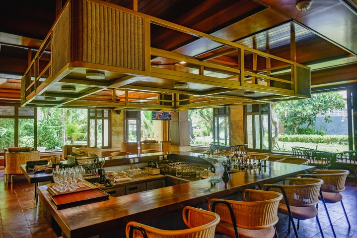 Bar at Patra Bali Resort and Villas with elegant wooden interiors