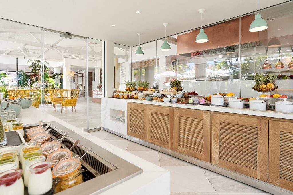 Bright and fresh breakfast buffet setup at Paradise Cove Boutique restaurant