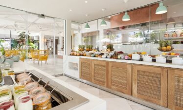 Bright and fresh breakfast buffet setup at Paradise Cove Boutique restaurant