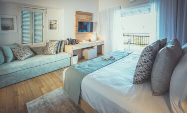 Carana Beach Hotel bedroom with oceanfront balcony