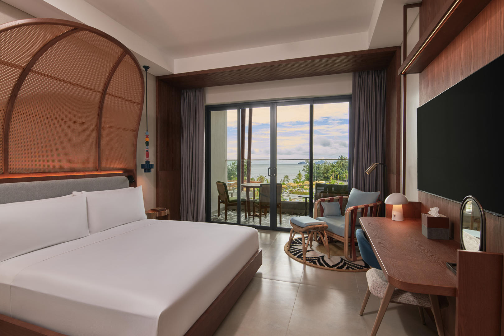 Comfortable bedroom at Canopy by Hilton with balcony and ocean view