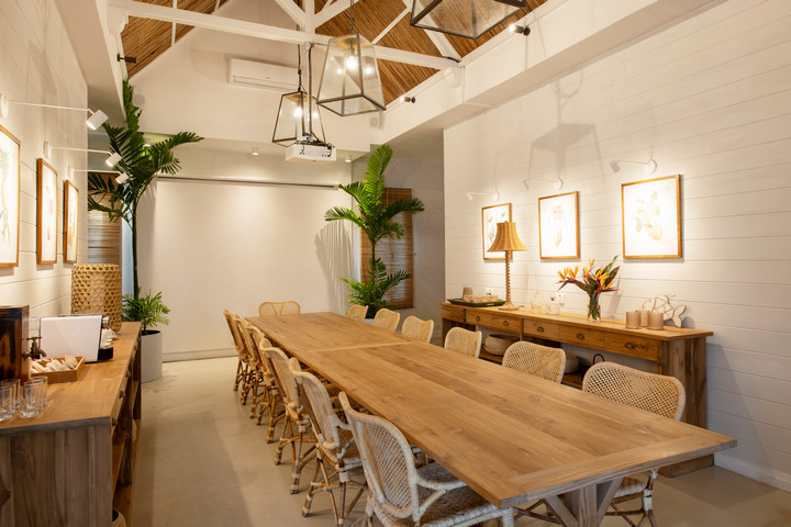 Conference room at Veranda Grand Baie with a long wooden table and stylish decor