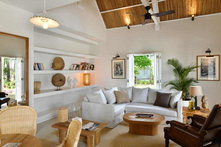 Cozy sitting area with bookshelves at Veranda Grand Baie
