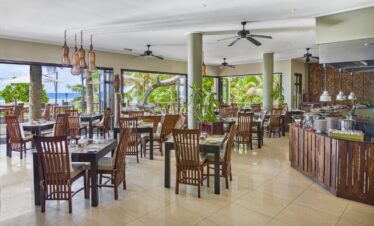 Doubletree by Hilton beachfront restaurant with open-air seating