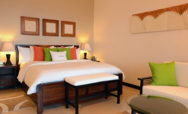 Elegant guestroom at Doubletree by Hilton with plush bedding