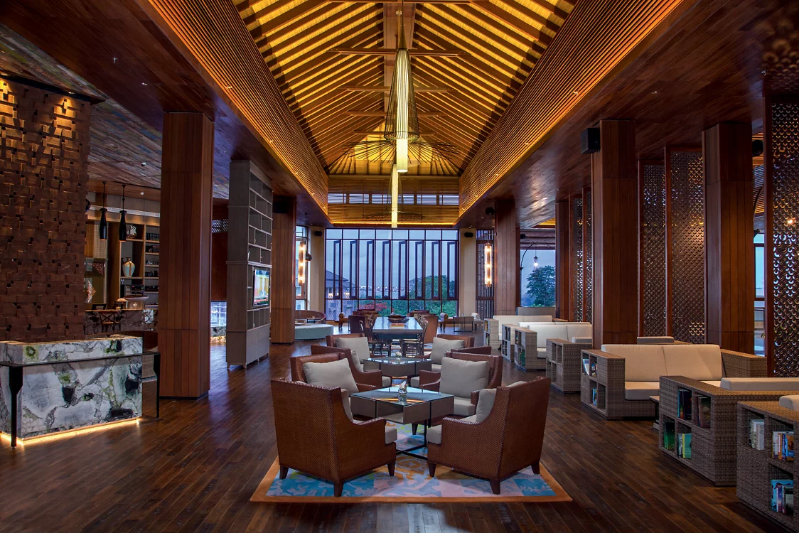 Elegant lobby lounge at MOVENPICK JIMBARAN with wooden interiors