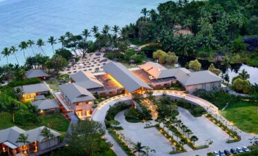 Entrance to Kempinski Seychelles Resort with lush tropical landscape