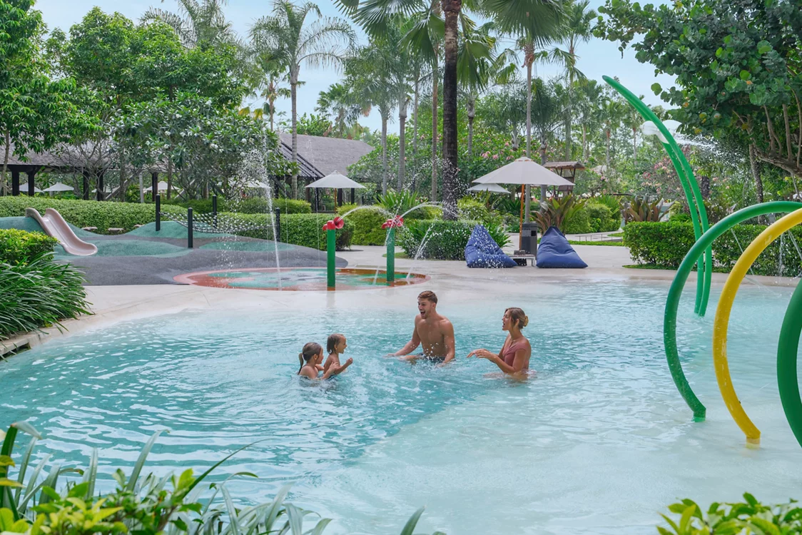 Family enjoying the water play area at MOVENPICK JIMBARAN resort