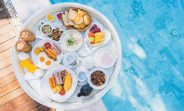 Floating breakfast set in tray with fried egg omelette sausage h