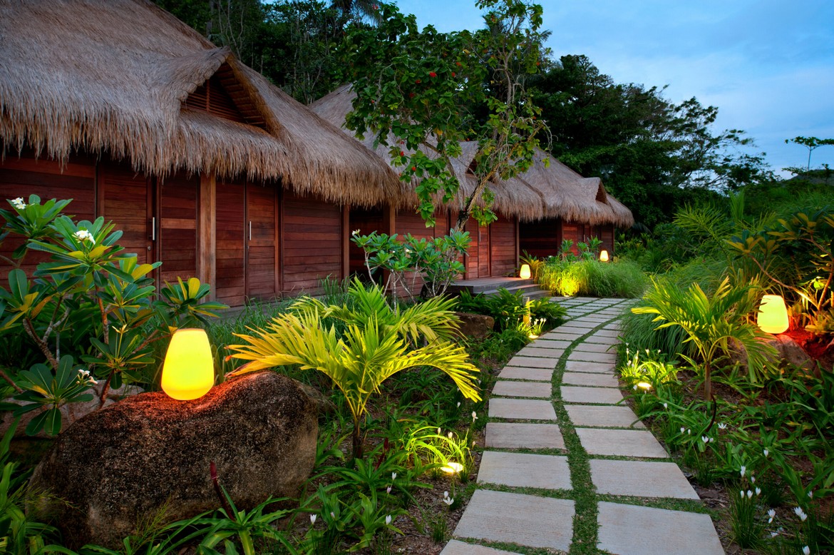 Garden pathway to tropical bungalows at Kempinski Seychelles Resort