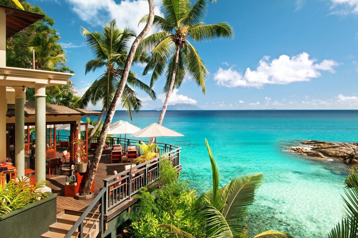 Hilton Seychelles Northolme Resort restaurant with lush tropical surroundings
