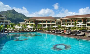 Infinity pool at Savoy Seychelles with mountain backdrop