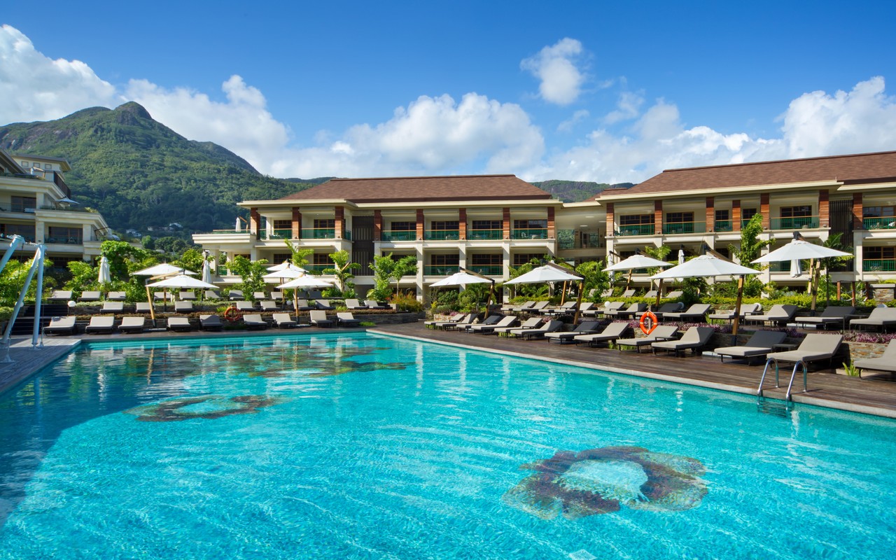 Infinity pool at Savoy Seychelles with mountain backdrop