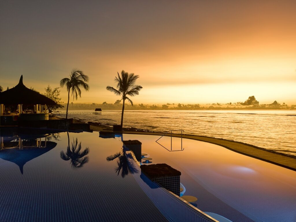 Infinity pool reflecting sunset at Nirvana At Le Meridien Ilse Mauritius for a tranquil evening swim