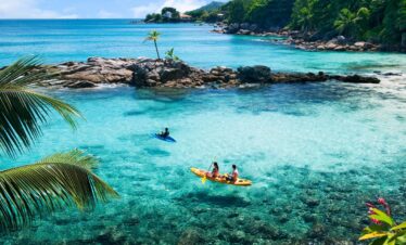 Kayaking in turquoise waters near Hilton Seychelles Northolme Resort