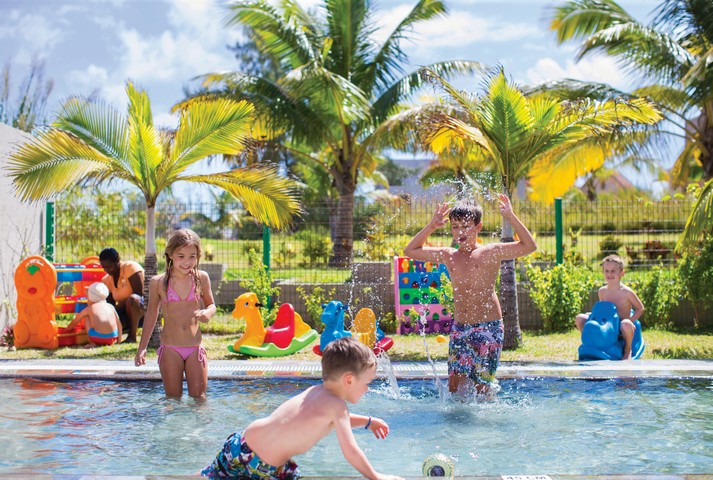 Kids enjoying pool activities at Crystals Beach Resort family-friendly play area