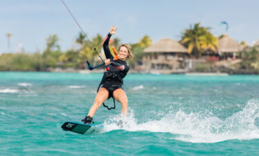 Kitesurfing on turquoise waters near Lagoon Attitude Mauritius