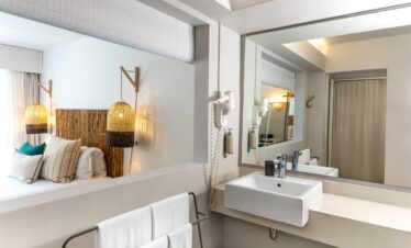 Lagoon Attitude Mauritius bedroom with bamboo decor and modern bathroom