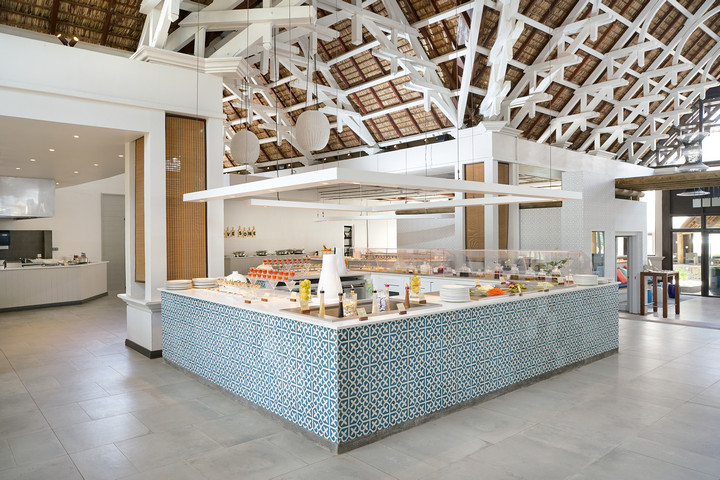 Lagoon Attitude Mauritius buffet area with modern decor and traditional roofing
