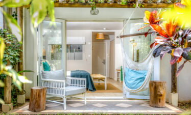 Lagoon Attitude Mauritius bungalow with hammock and outdoor seating surrounded by greenery