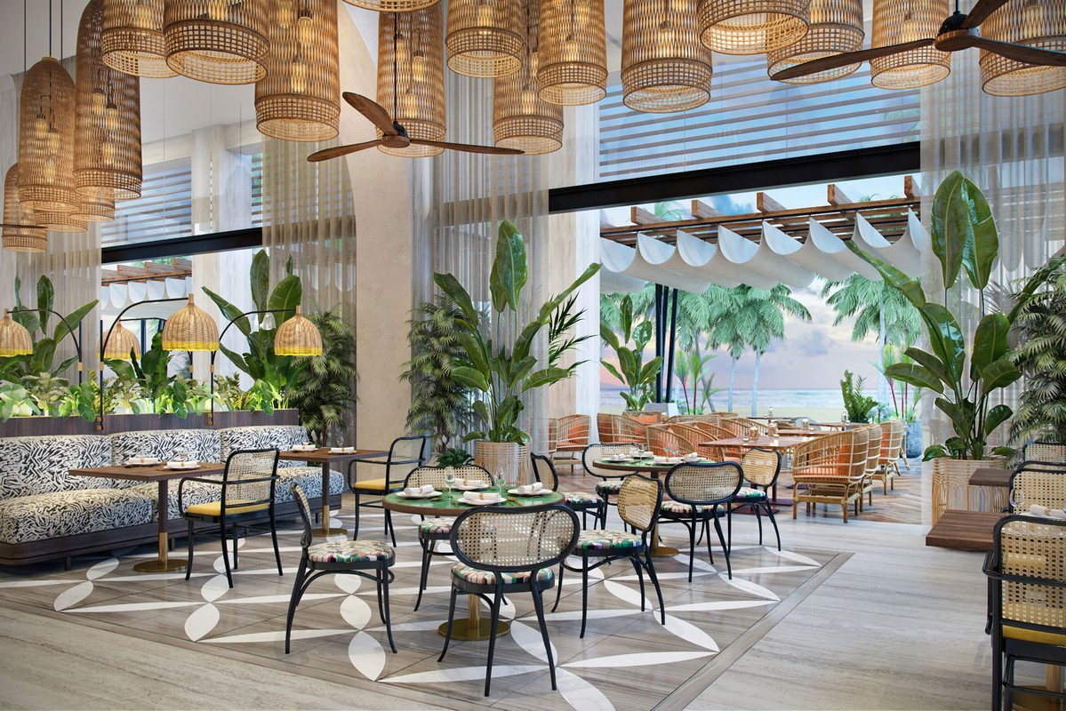 Lush dining area at Canopy by Hilton with hanging lanterns and tropical plants
