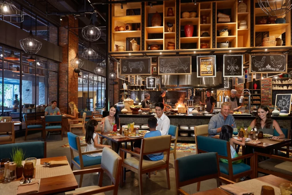 MOVENPICK JIMBARAN dining area with open kitchen and warm ambiance