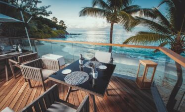 Oceanfront dining setup at Carana Beach Hotel Lorizon restaurant