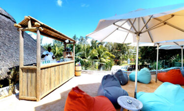 Poolside bar with bean bags and umbrellas at Radisson Blu Poste Lafayette