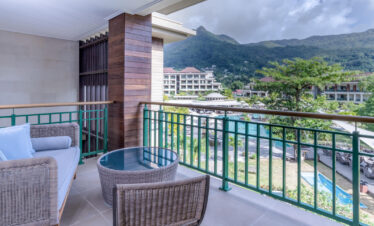 Private balcony at Savoy Seychelles with resort and mountain views