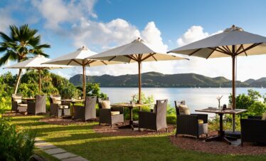 Raffles Praslin outdoor dining with stunning ocean views