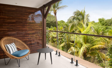 Relaxing balcony view of lush greenery at Nirvana at Le Meridien Ile Mauritius