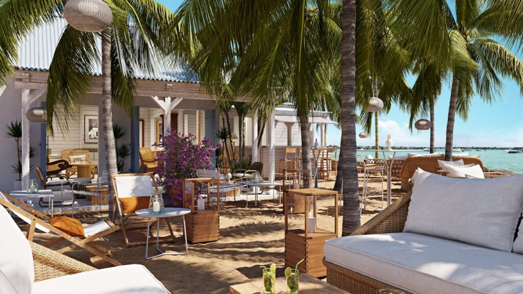 Relaxing beachside lounge area at Veranda Grand Baie with palm trees and ocean views