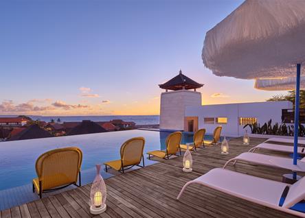 Rooftop infinity pool at ALOFT BALI with sunset and ocean views