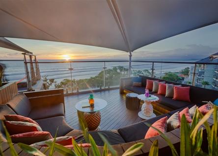 Rooftop seating at Double Six Seminyak with panoramic sunset views