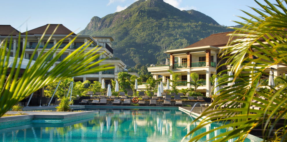 Savoy Seychelles infinity pool surrounded by lush greenery