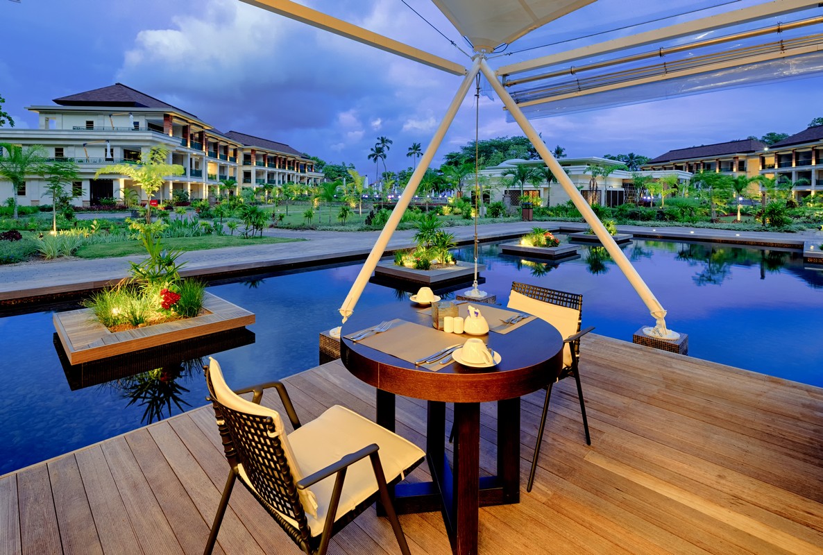 Savoy Seychelles poolside dining with a serene evening view