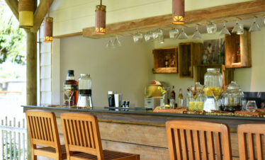 Solana Beach resort bar with rustic decor and various drink selections on display