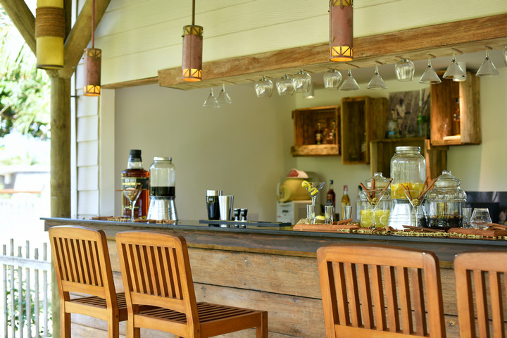 Solana Beach resort bar with rustic decor and various drink selections on display