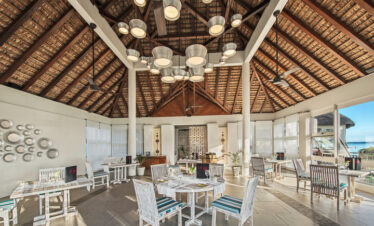 Solana Beach restaurant interior with high ceilings elegant seating and beachside view