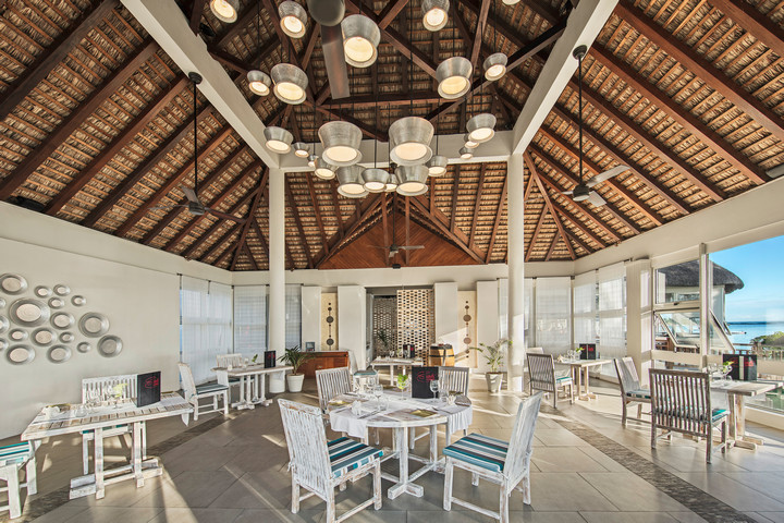 Solana Beach restaurant interior with high ceilings elegant seating and beachside view