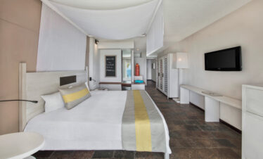 Spacious guest room at Solana Beach with comfortable bed and modern decor