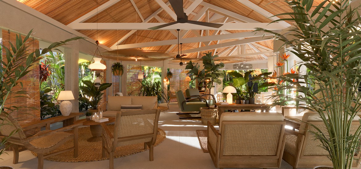 Spacious lounge with wooden furniture and lush plants at Veranda Grand Baie