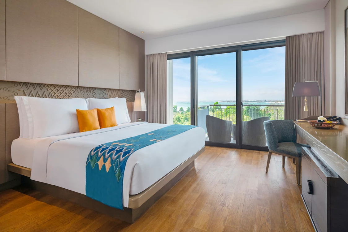 Spacious ocean-view suite at MOVENPICK JIMBARAN with elegant decor