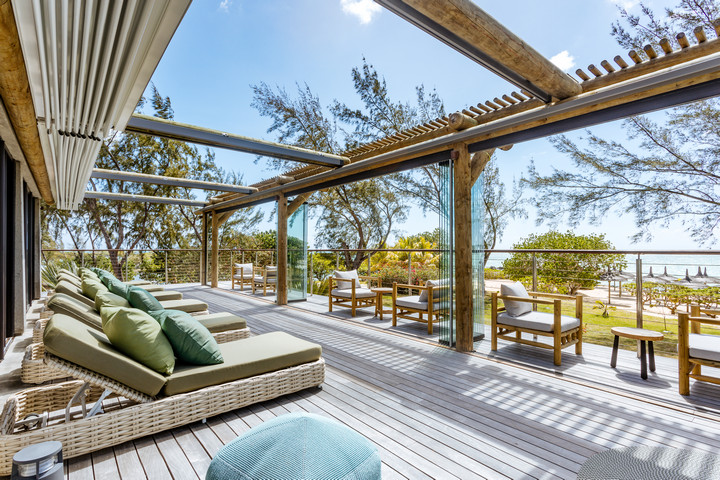 Spacious sun deck at Lagoon Attitude Mauritius with lounging chairs and ocean view