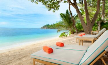 Sun loungers on Baie Lazare Beach at Kempinski Seychelles Resort