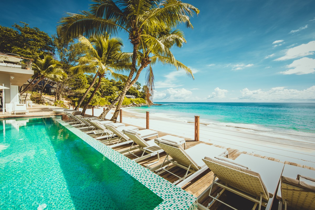 Sun loungers on the deck at Carana Beach Hotel beachfront