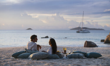 Sunset beach picnic at Raffles Praslin with ocean views