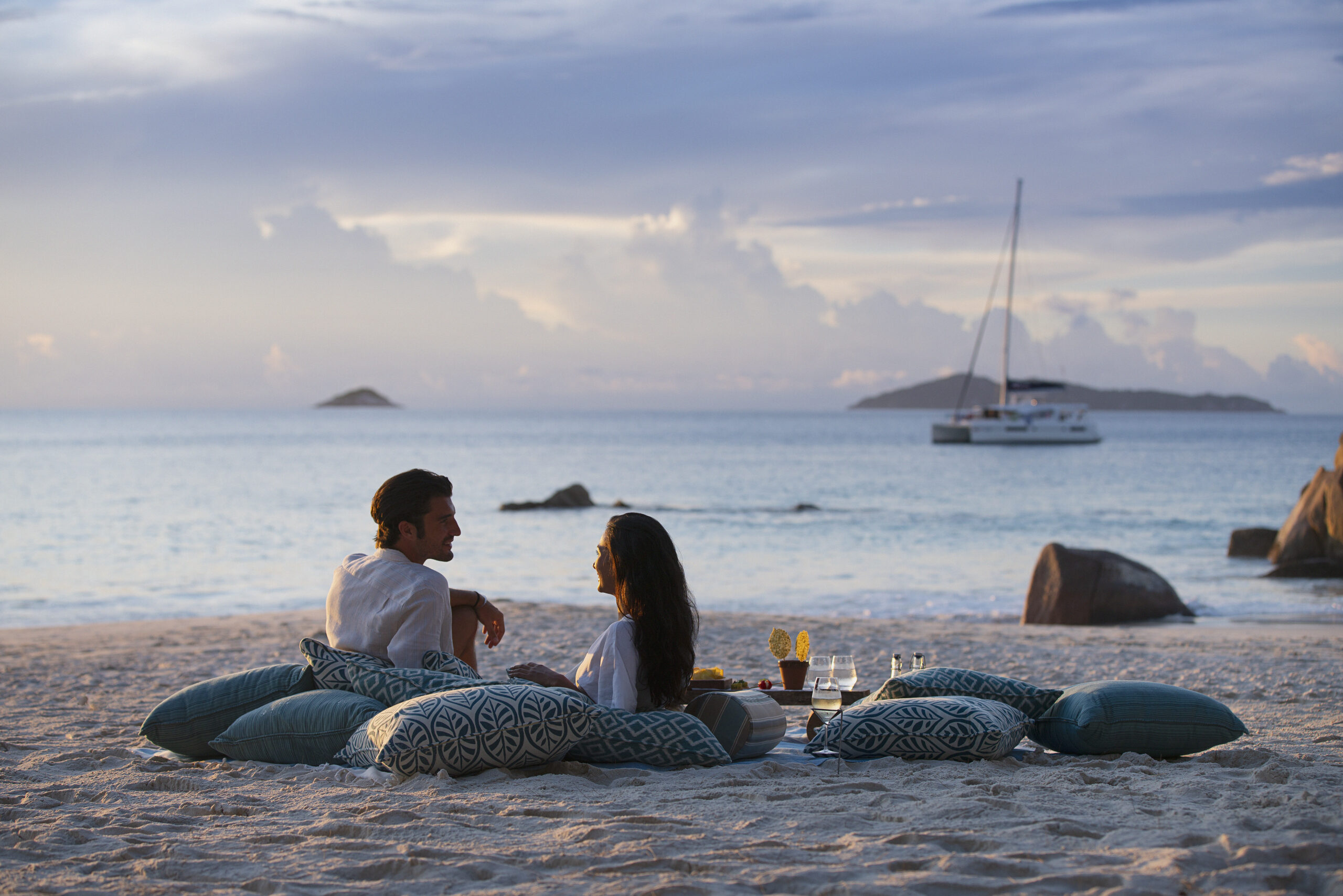Sunset beach picnic at Raffles Praslin with ocean views